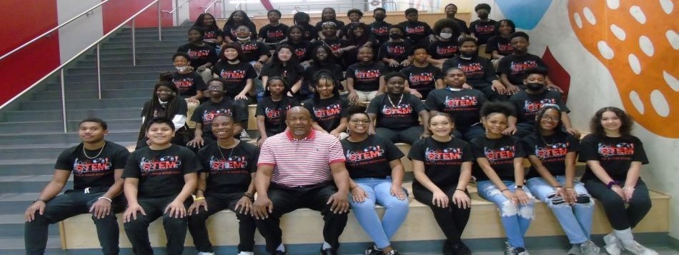Photo of the STEM students and Principal Ronald Mitchell at Ronald E. McNair Middle School.