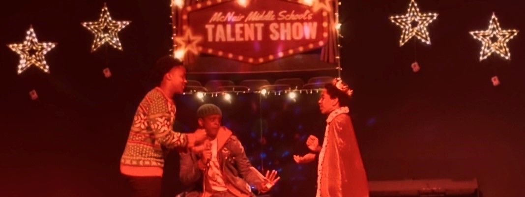 Teacher and 2 students performing in a skit in the talent show