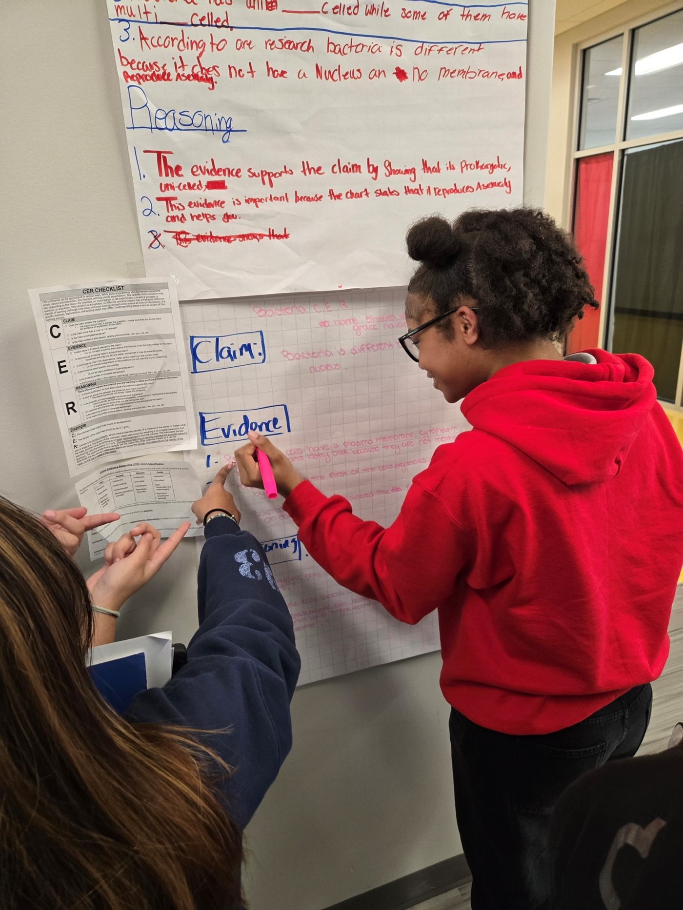 female students completing a CER project